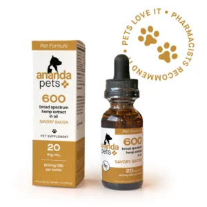 A bottle and box of ANANDA PETS HEMP EXTRACT (savory bacon flavor) for pets, labeled 20mg/mL broad spectrum hemp with a gold paw print stamp: “PETS LOVE IT • PHARMACISTS RECOMMEND.”.