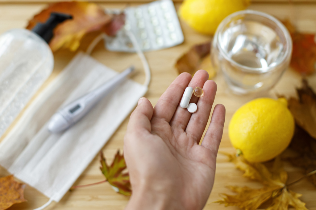 Hand holding immune boosting supplements