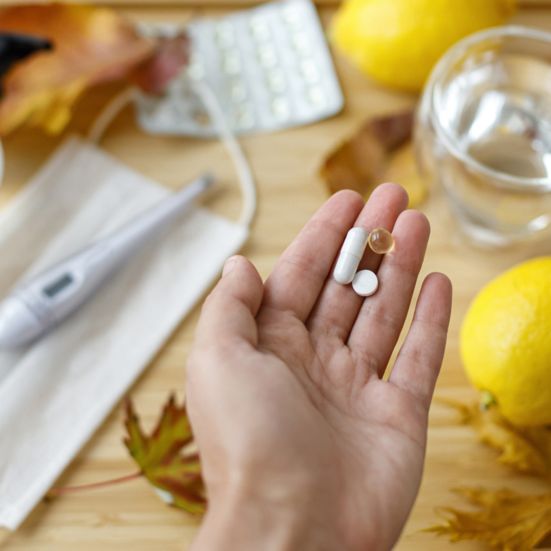 Hand holding immune boosting supplements