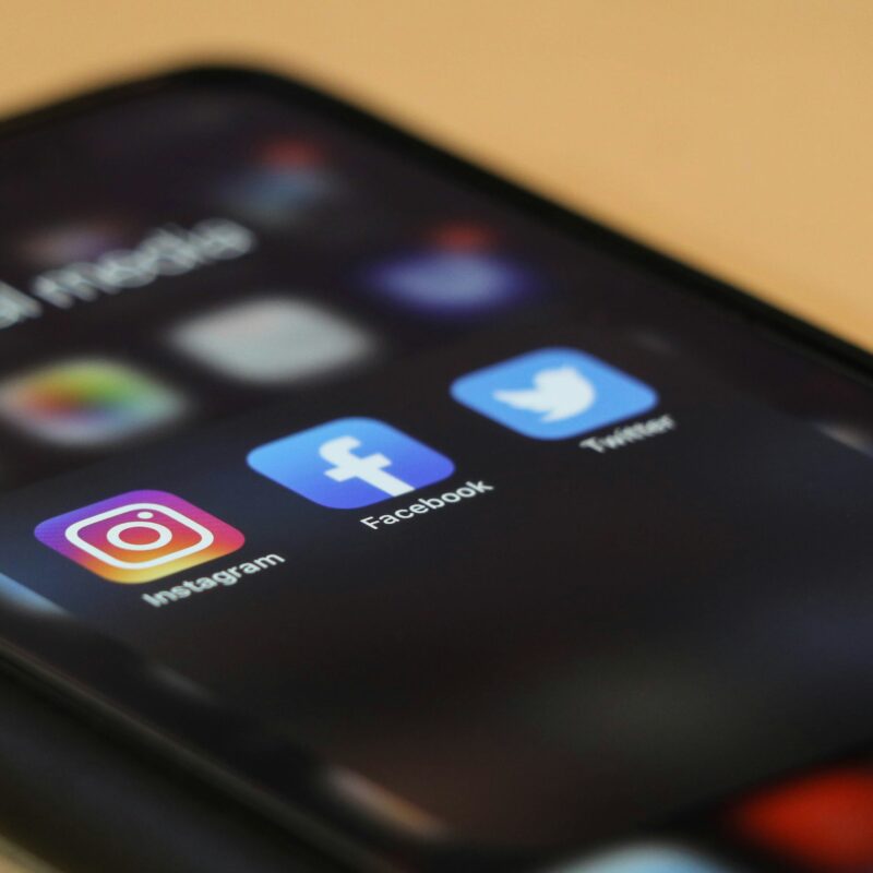 phone with social media apps on table