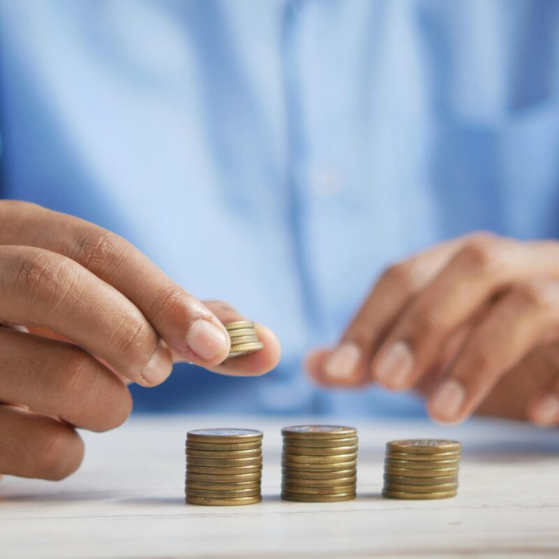 person budgeting coins